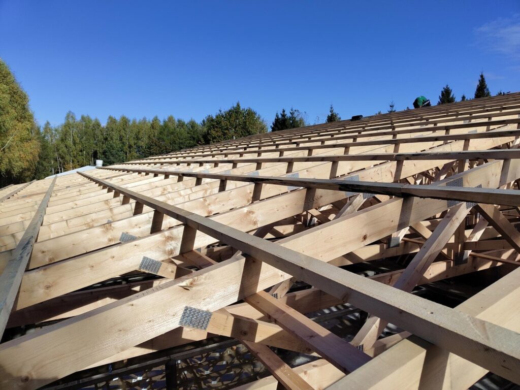 side view wooden roof trusses construction site with bright blue sky showing intricate assembly metal connectors 1069077 17904 side view wooden roof trusses construction site with bright blue sky showing intricate assembly metal connectors 1069077 17904